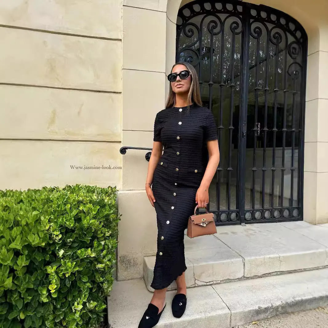 French retro slim fit long-sleeved knitted dress with button detail, shown in black and white colour options.