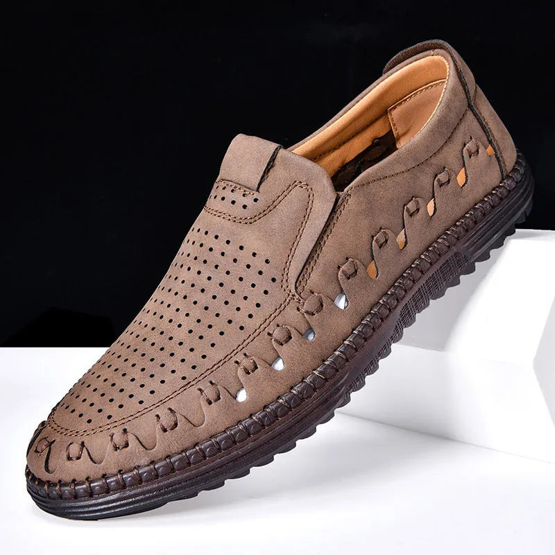 Men's brown slip-on casual shoes with round toe, sewing line detail, and flat PVC sole.