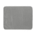 Black honeycomb double layer cat litter mat with non-slip bottom placed near litter box