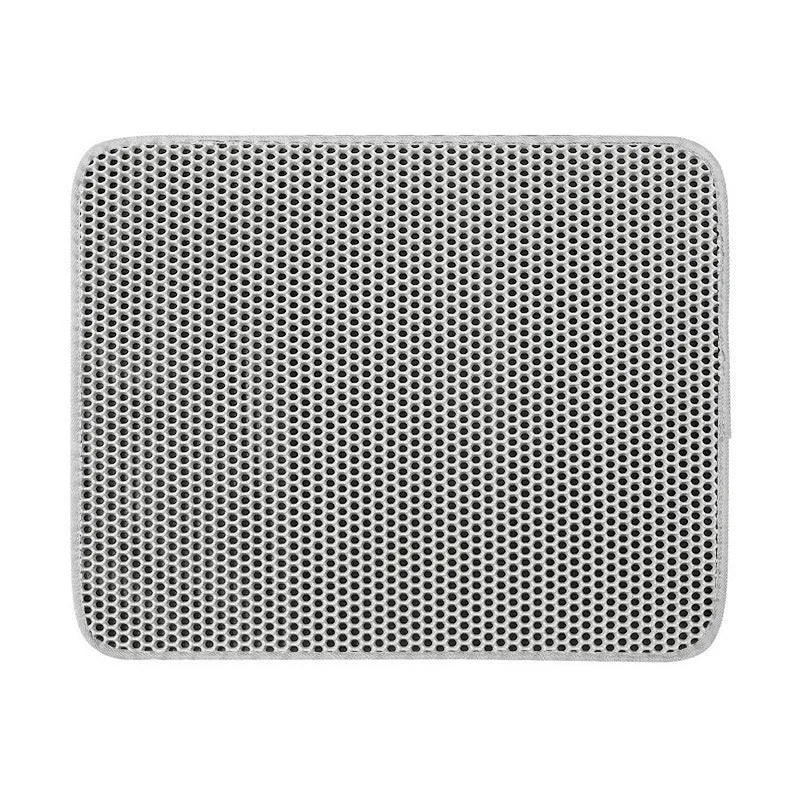 Black honeycomb double layer cat litter mat with non-slip bottom placed near litter box