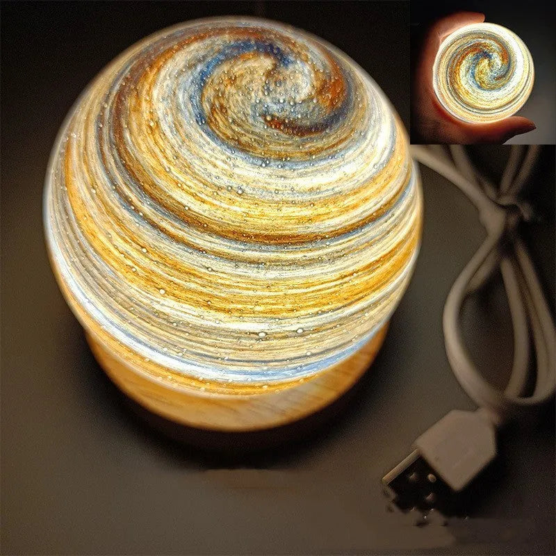 Modern planet-shaped USB night light on its base with dimmable multi-colour glow