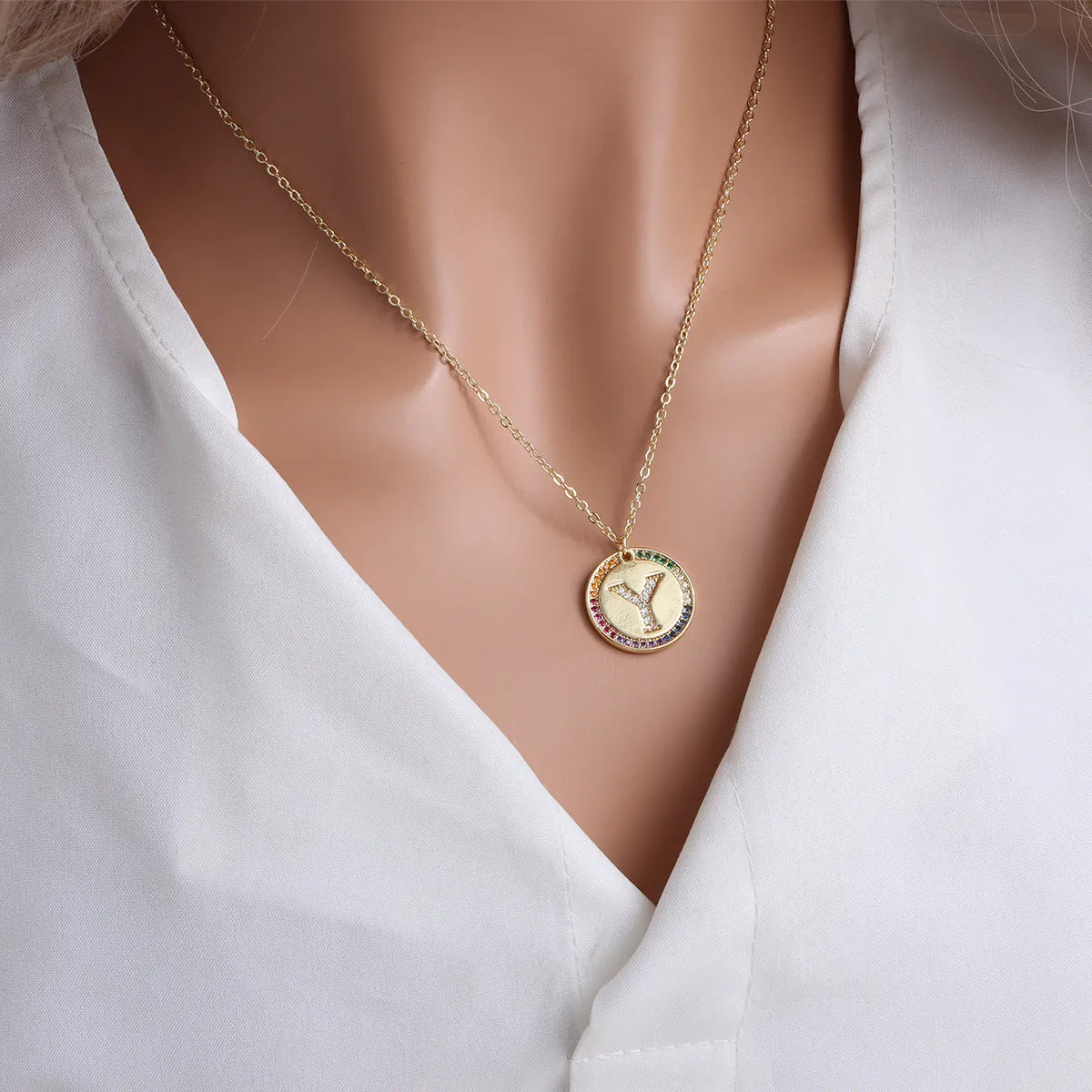Gold English letter round pendant necklace with colourful crystals on clavicle length chain