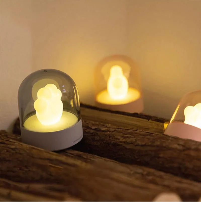 Grey and pink cat paw shaped USB rechargeable musical night light with adjustable brightness