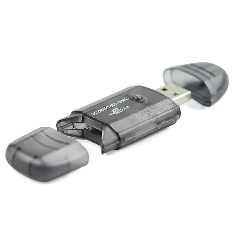 Transparent USB card reader with optional LED light on a desk next to memory cards.