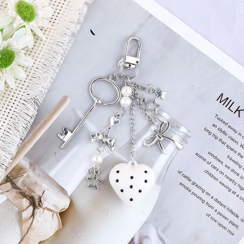 Retro zinc alloy key ring with bow and love heart chain design in multiple colour options
