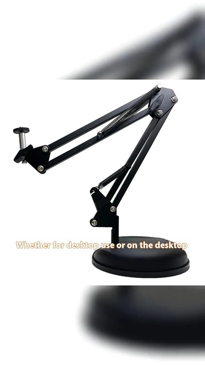 Black foldable metal desktop cantilever bracket holding a tablet, showing adjustable arm and clip.