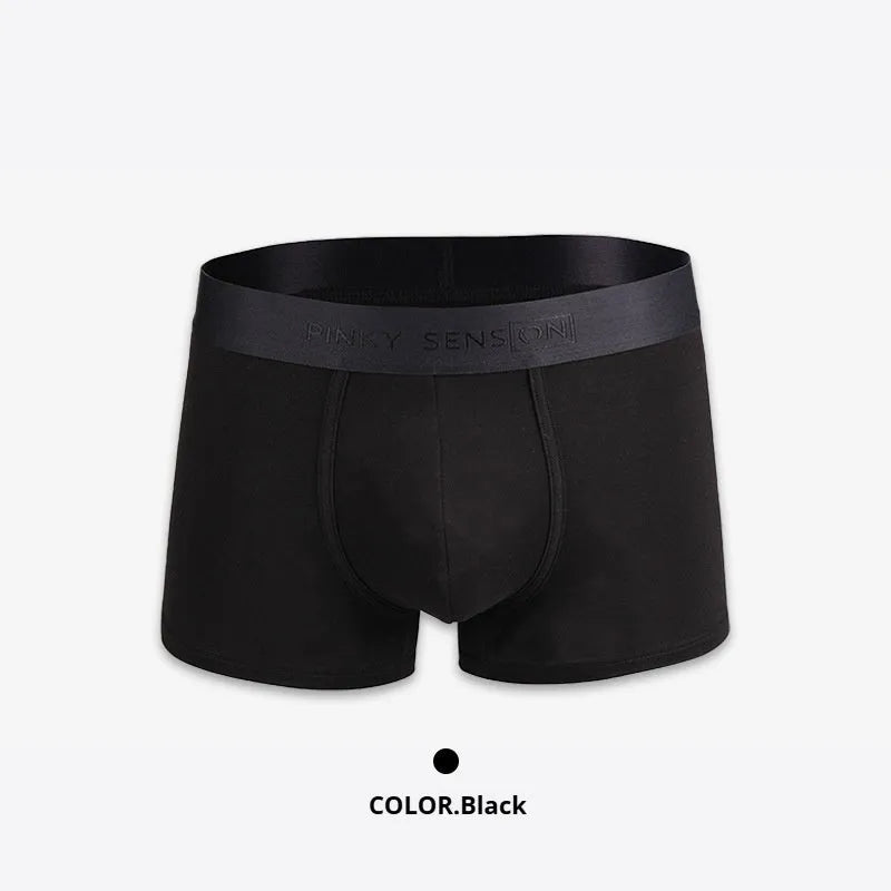 Men's solid colour cotton boxer shorts in black, shown flat.