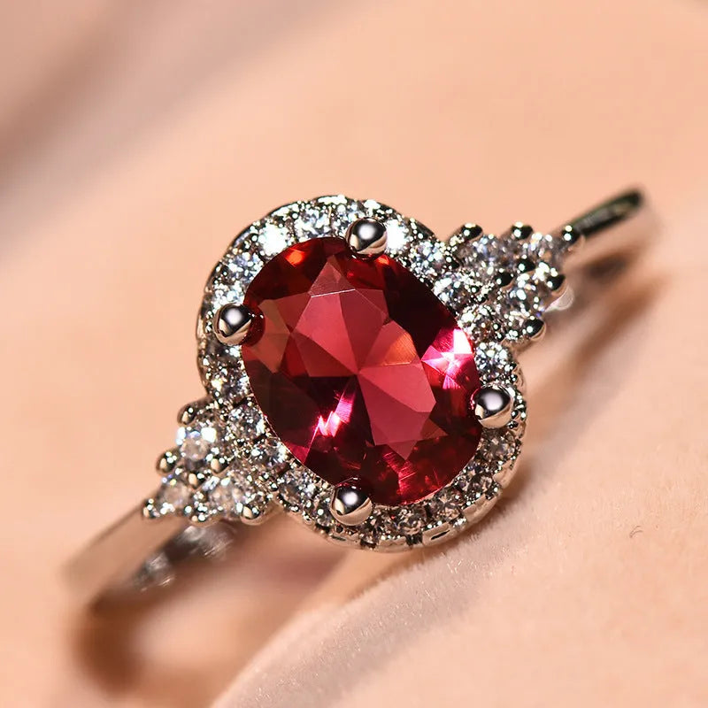 Oval ruby colour copper ring with adjustable open mouth design and white gold tone finish