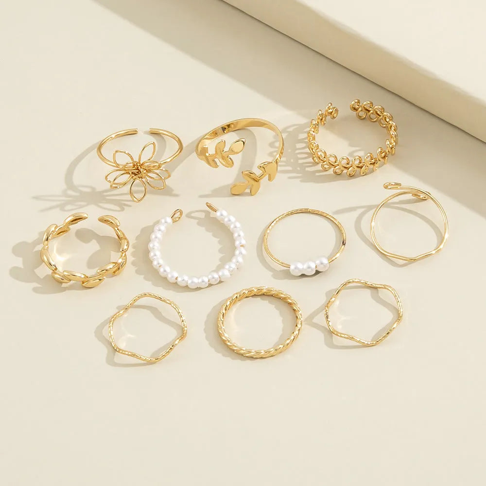 Openwork floral ring set with glossy electroplated finish in gold colour