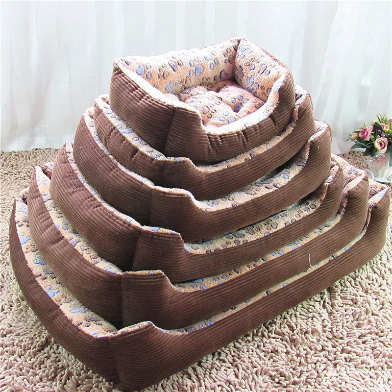Beige plush sofa dog bed with raised rim for a small dog, showing non-slip base.