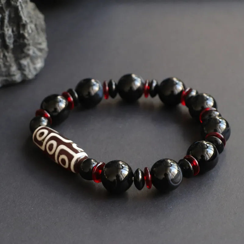 Hand-woven black agate Dzi bead bracelet with 11mm geometric chalcedony beads