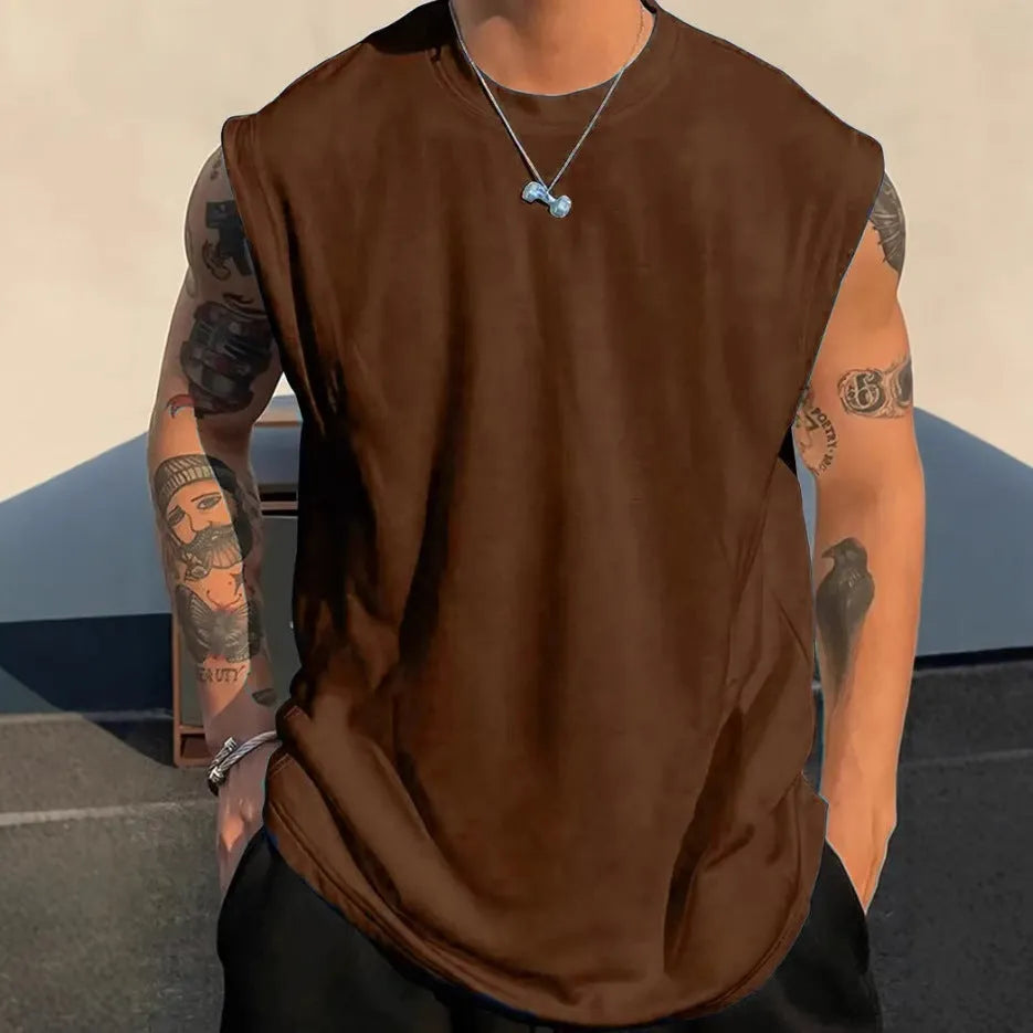Men's loose sleeveless cotton t-shirt in a solid colour on a hanger.