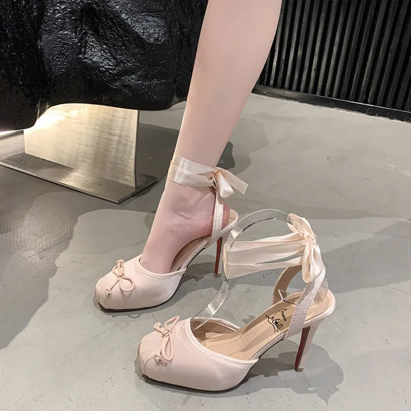Women's satin high heel sandals with cross strap, round toe, and 6-8cm stiletto heel in black or pink