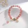 Natural strawberry quartz Mori-style bracelet with floral details on electroplated metal