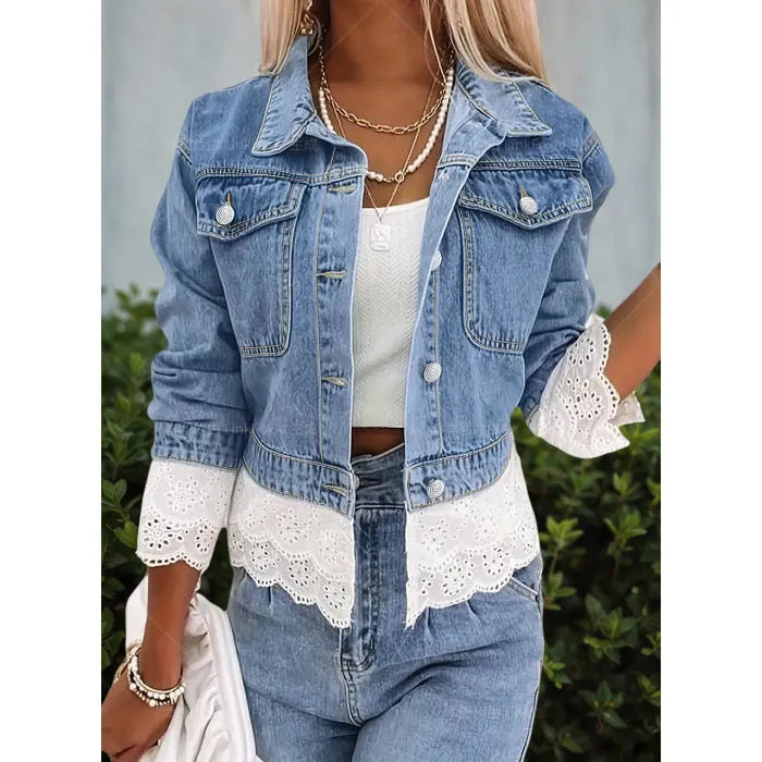 Blue women's denim jacket with lace stitching detail, shown on a hanger.
