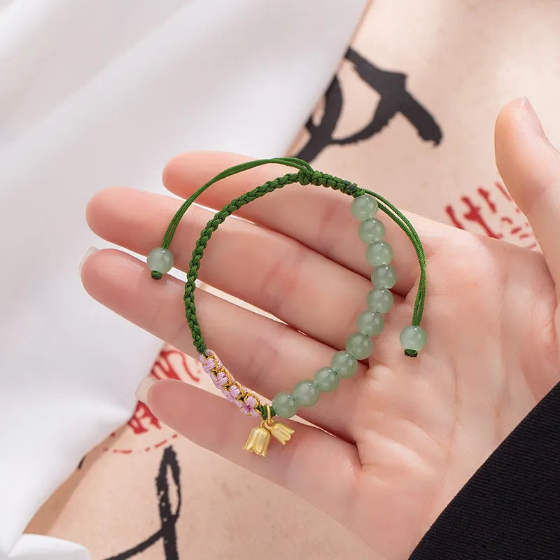 Hand woven red rope bracelet with flower decorations in national style women's design