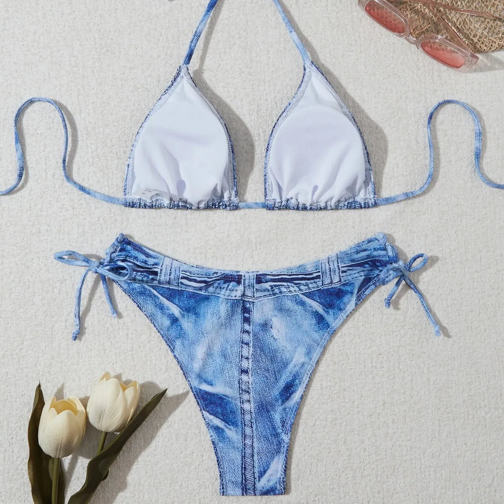 Denim blue printed women's bikini set with strap design on a mannequin.