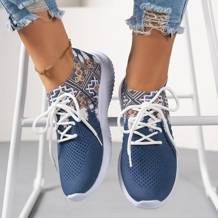 Women's woven flat casual sneakers in green with mesh upper, round toe, front lace-up, and rubber sole