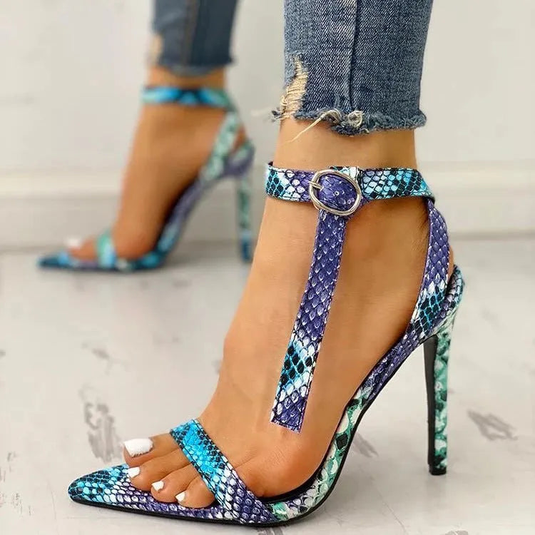 Blue women's high heels with hollow-out detail and a buckle strap on a pointed toe.