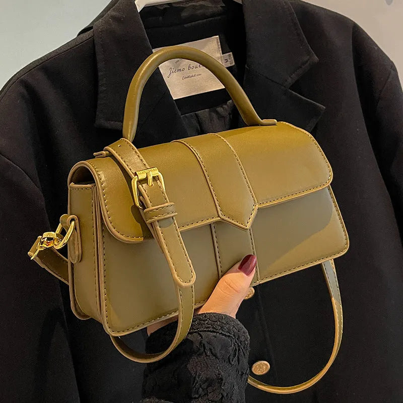 Beige women's horizontal square messenger bag with sandwich pocket and file organiser interior.