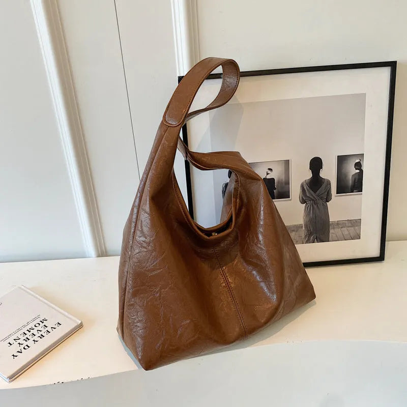 Soft PU leather shoulder bag with multiple external sandwich pockets in street-style design