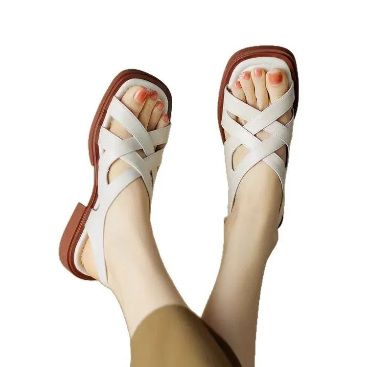 Women's patent leather sandals with square toe and low heel in black, brown and off-white colours