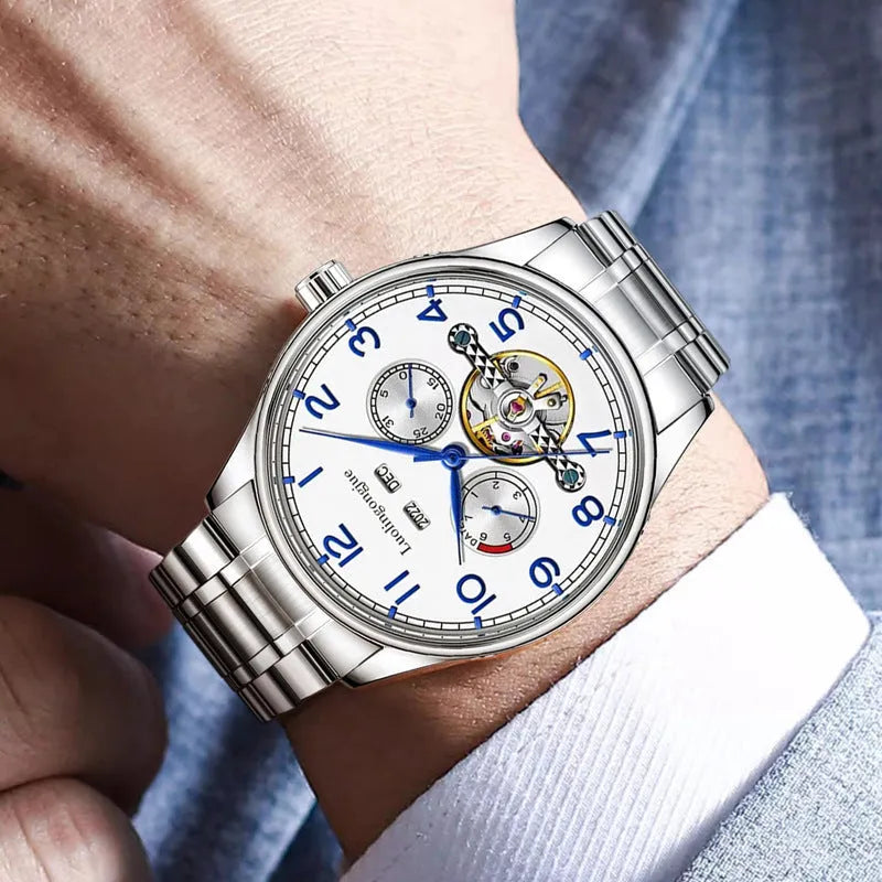 Men's stainless steel mechanical watch with a leather strap and sapphire crystal glass on a wrist.