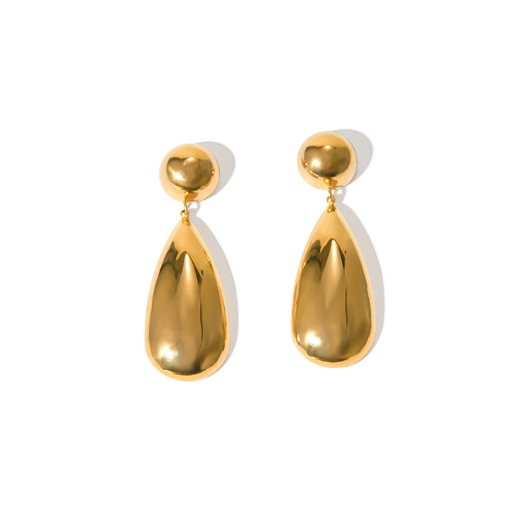 A pair of gold geometric hemisphere earrings with a water droplet pendant design on a white background.