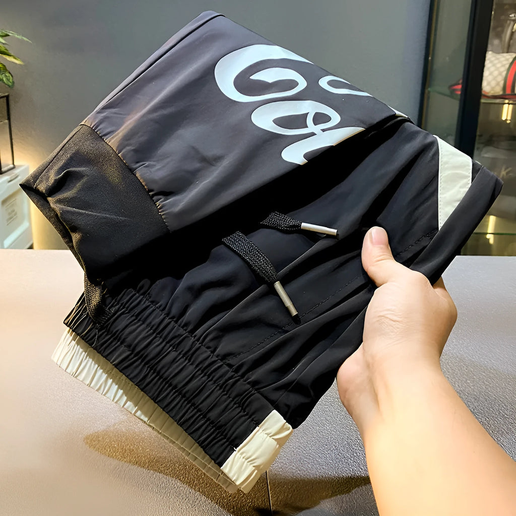 Black men's cropped casual trousers with ankle banding made from ultra-thin ice silk and cotton.