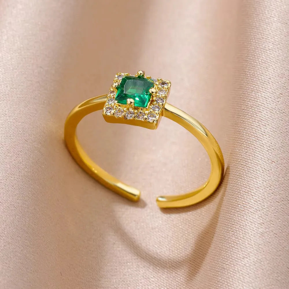 18K gold plated copper open mouth ring with synthetic zircon love emerald motif on white background