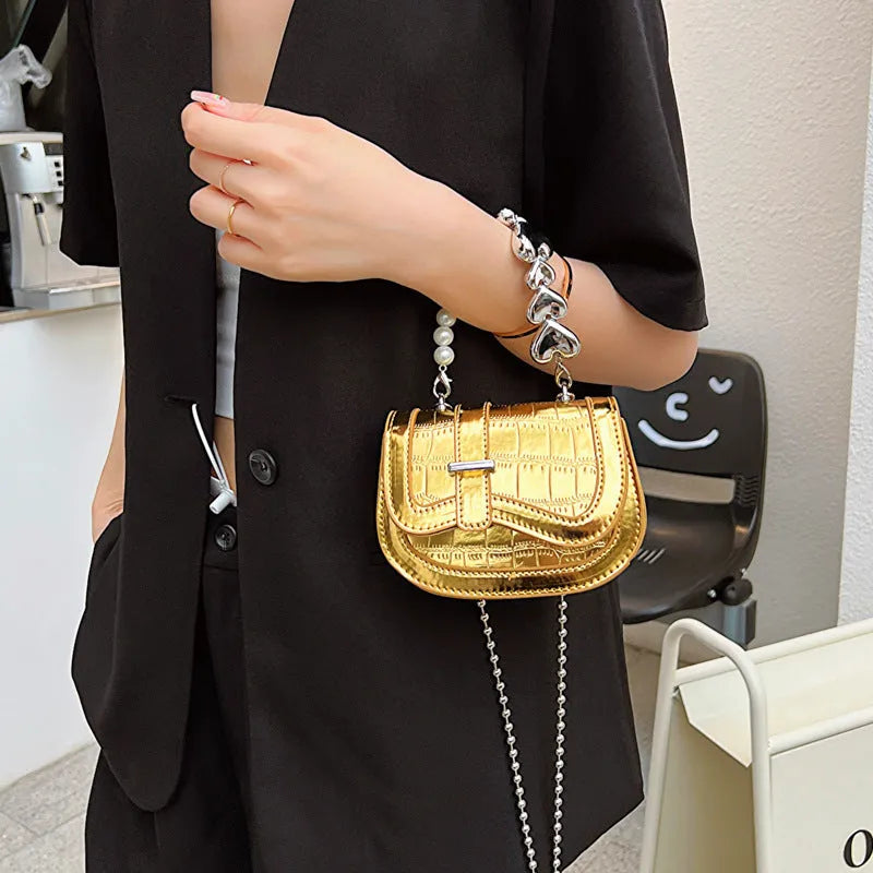 Silver women's PU leather crossbody bag in a horizontal square tote saddle shape with a single strap.
