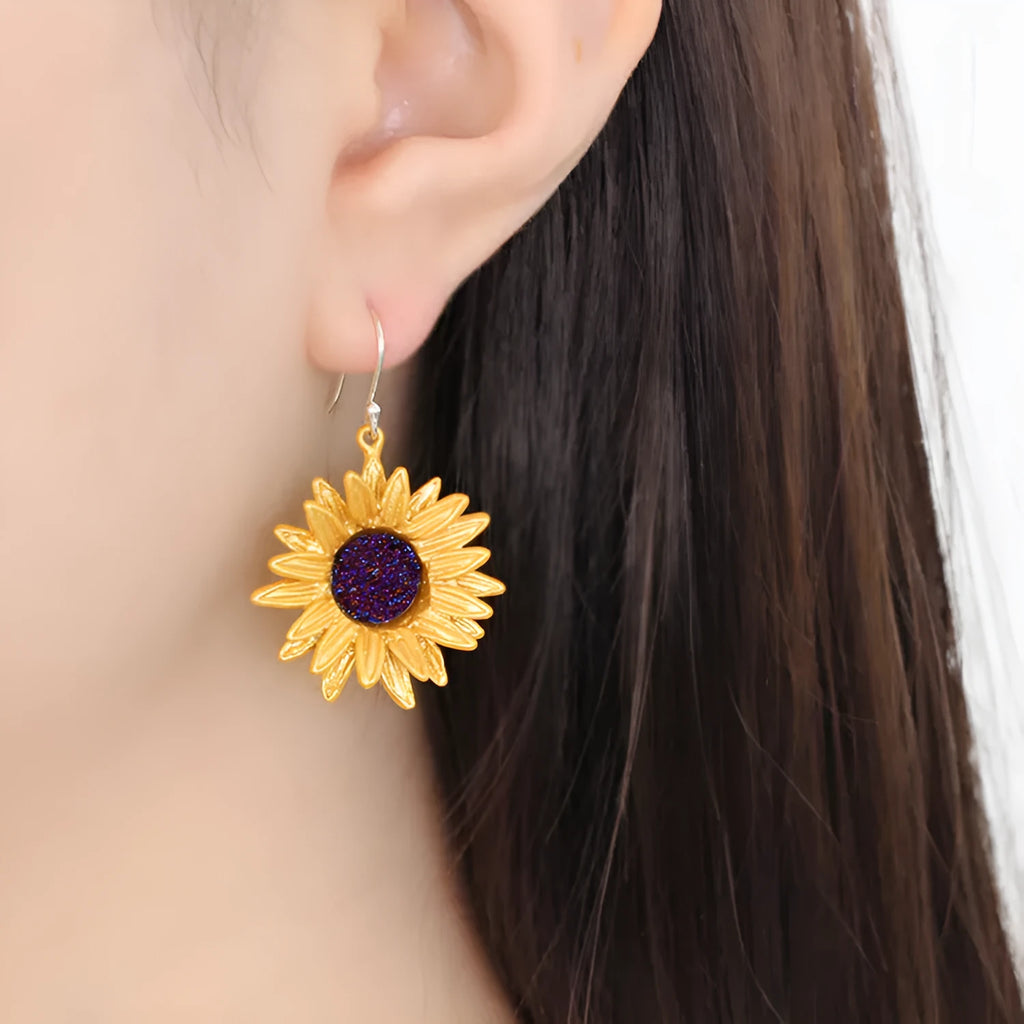 Gold-plated copper sunflower ear hook earrings with 4cm dangle length on a white background