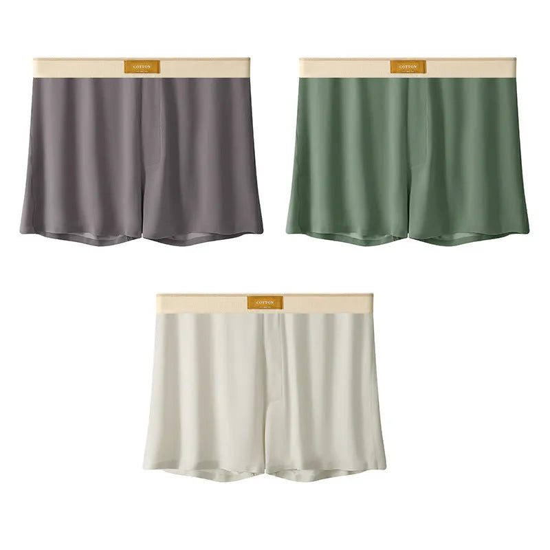 Pack of men's solid colour ice silk boxer shorts showing loose fit and mid-waist design.