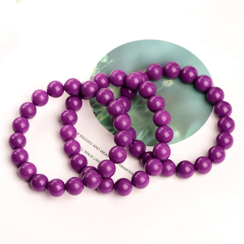 Single-strand Jiuya crystal bracelet in translucent purple mica with polished 8mm beads.