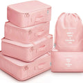 8-piece set of nylon packing cubes in various colours for travel storage of clothes, shoes, and toiletries