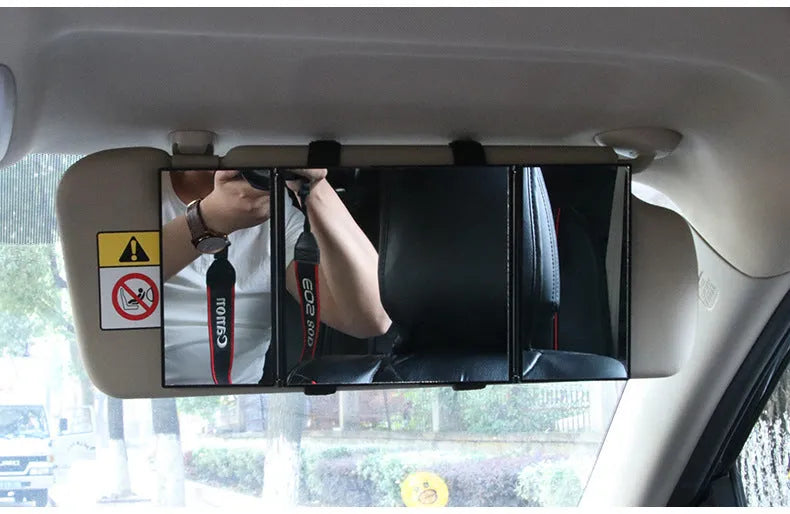 Silver folding car makeup mirror shown both closed and open on a car visor.