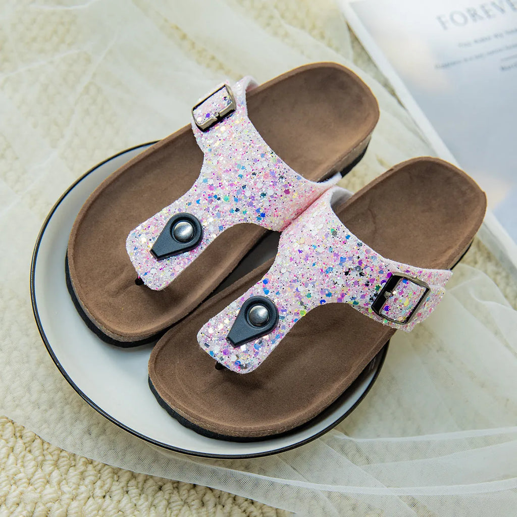 Gold frosted cork flip-flops with artificial leather upper and textured PVC sole.