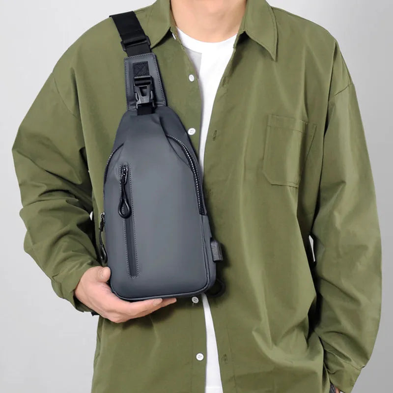 Black sling crossbody backpack for men with zipper and polyester lining, vertical square shape, solid colour design