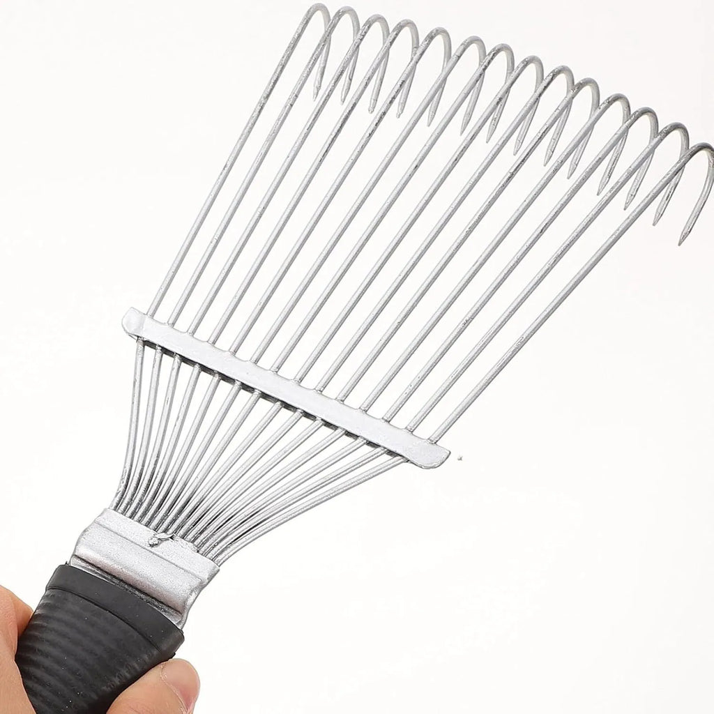 Stainless steel dematting brush and grooming rake for horses and pets on a wooden surface.