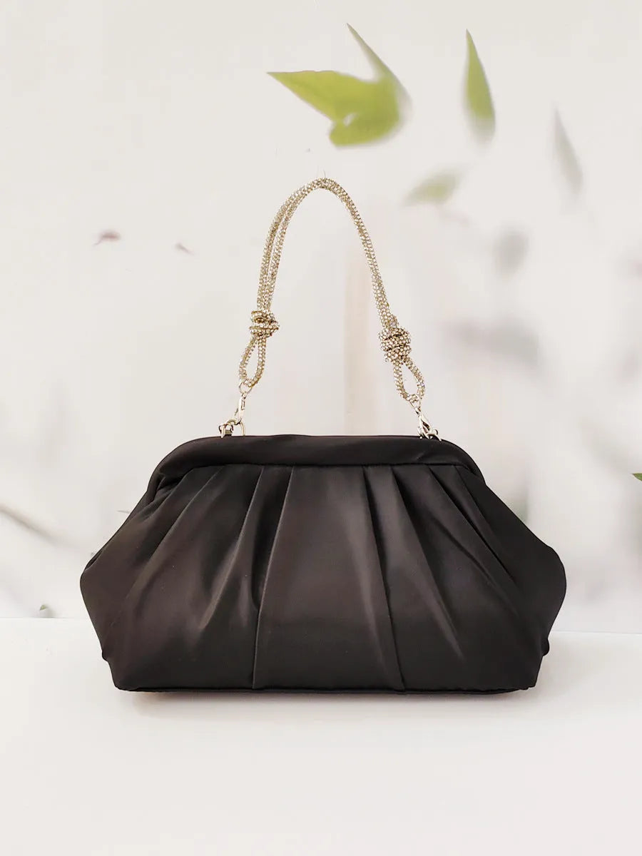 Women's diamond quilted crossbody messenger bag in soft polyester with chain detailing and document compartment