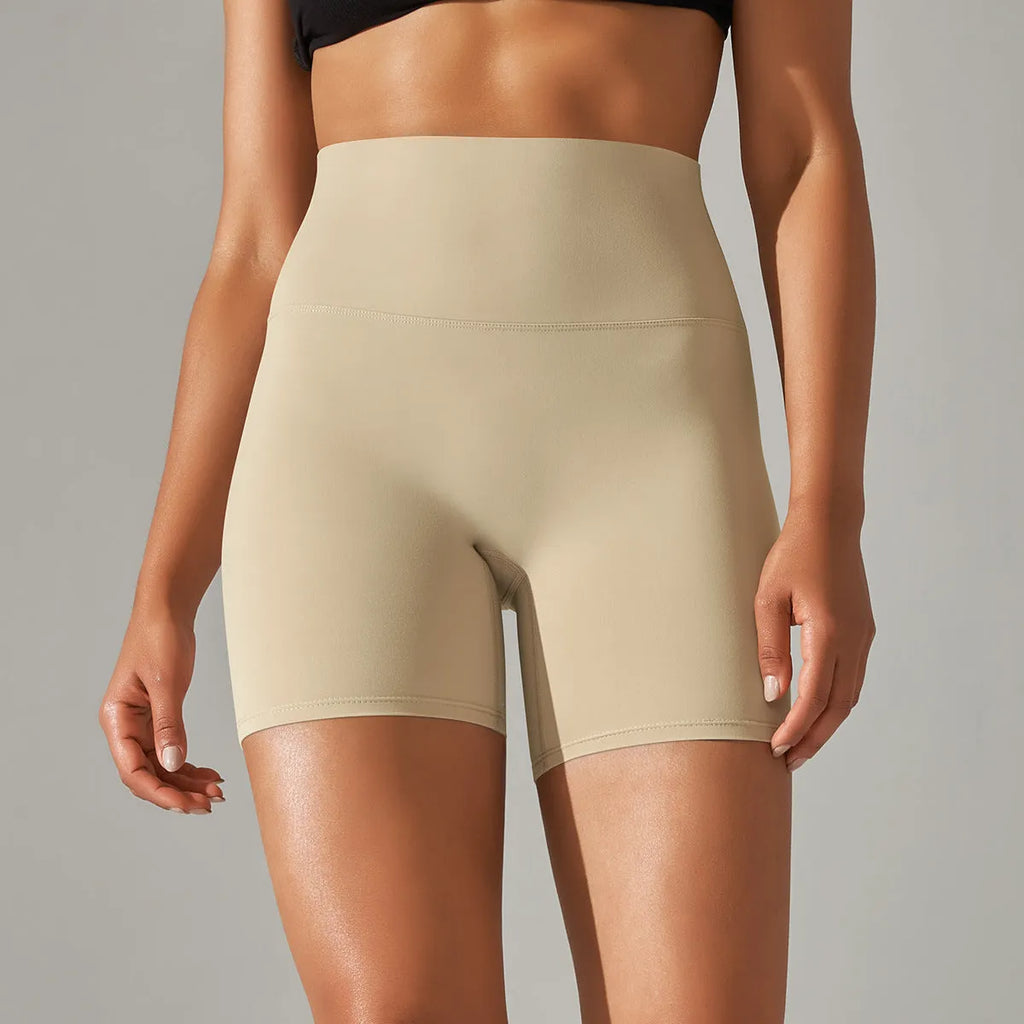 Women's high waist fitness tights in dark green colour with belly contracting design and hip lift construction