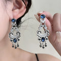Vintage court style earrings in blue crystal with geometric chamfered square grain shape, zinc alloy and electroplated finish