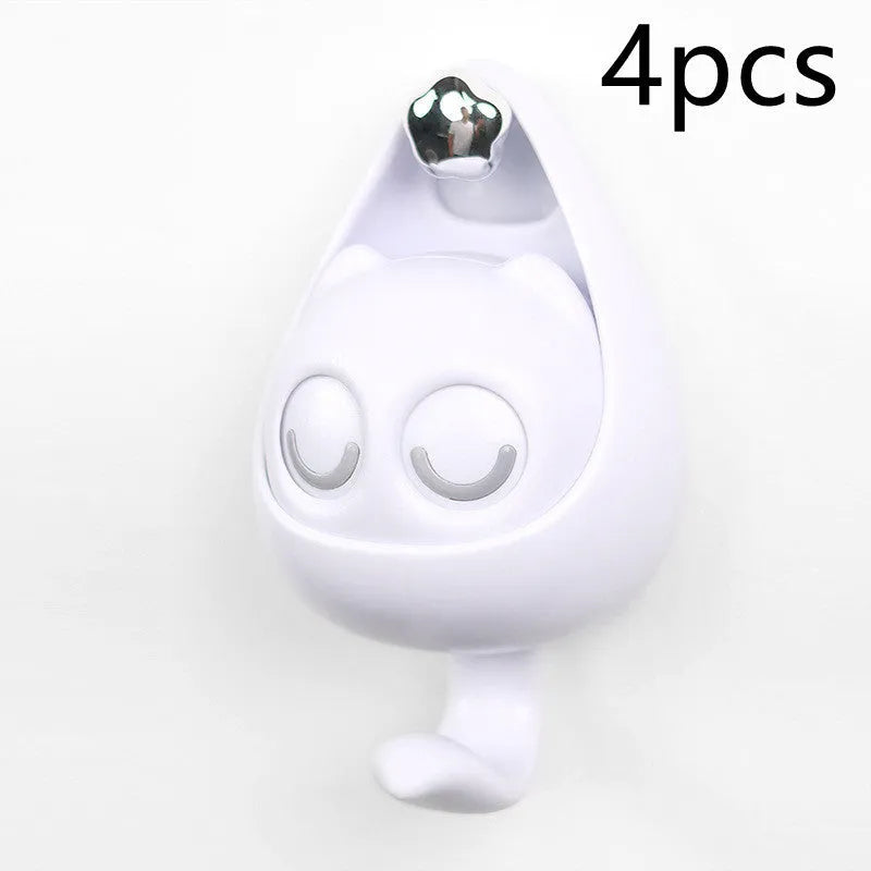 Cream white cat-shaped adhesive wall hook with winking eyes, 2.5kg capacity, 105x61x45mm