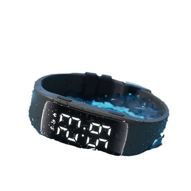 Smart electronic watch with LED display showing time, featuring vibration alarm and 50 metre waterproof rating with silicone strap