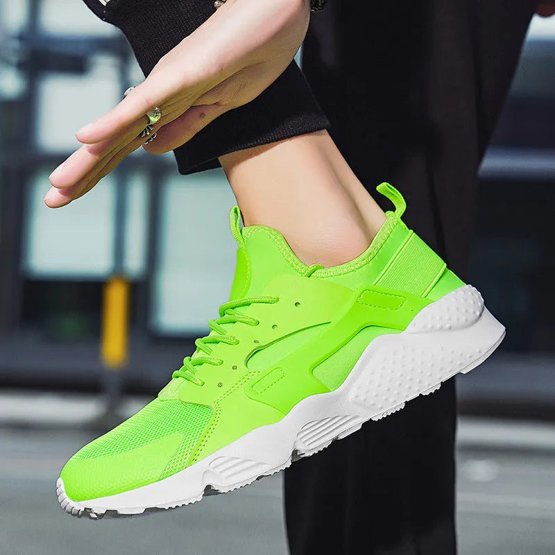 Men's low top mesh sneakers in fluorescent colours on a flat sole