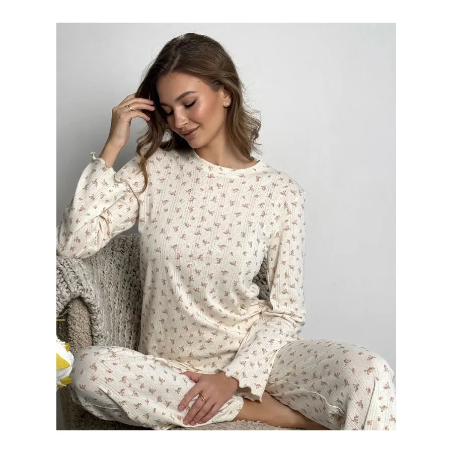 Women's white floral print bell sleeve top and wide-leg trousers loungewear set on a hanger.
