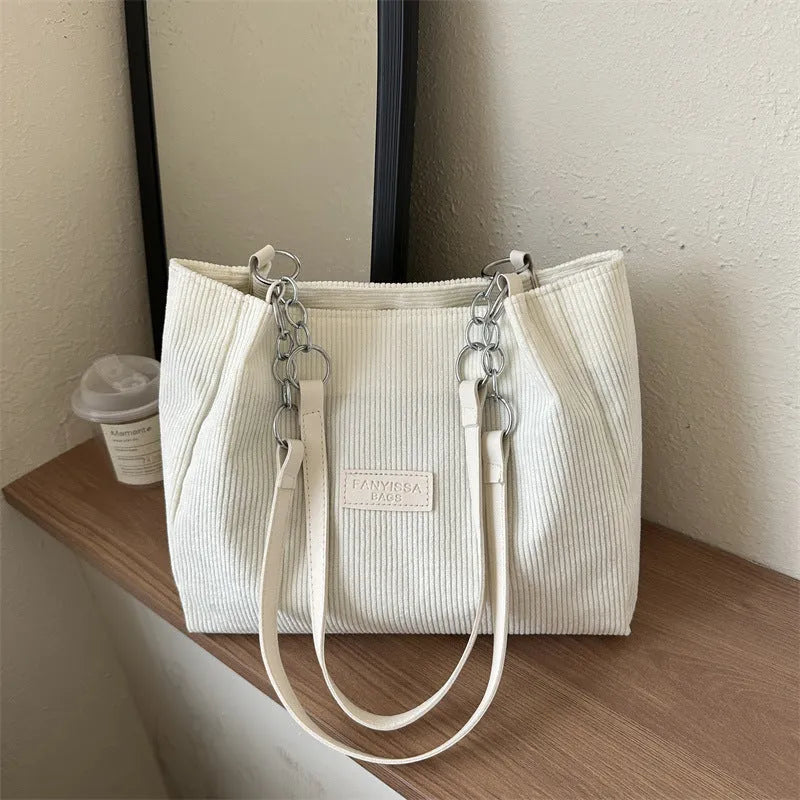 Corduroy one-shoulder tote handbag in black, brown, or white with horizontal square silhouette
