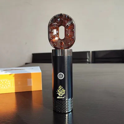 USB rechargeable Middle Eastern comb aromatherapy stove in silver, 14x5x4cm, on a car dashboard