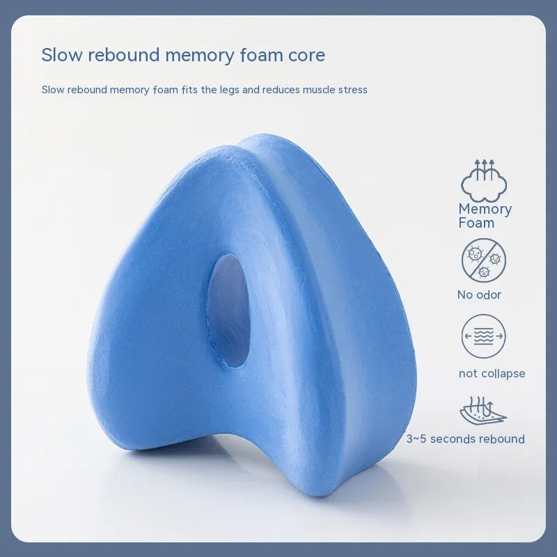 Dark blue jacquard love heart-shaped memory foam leg pillow for knee and hip support.