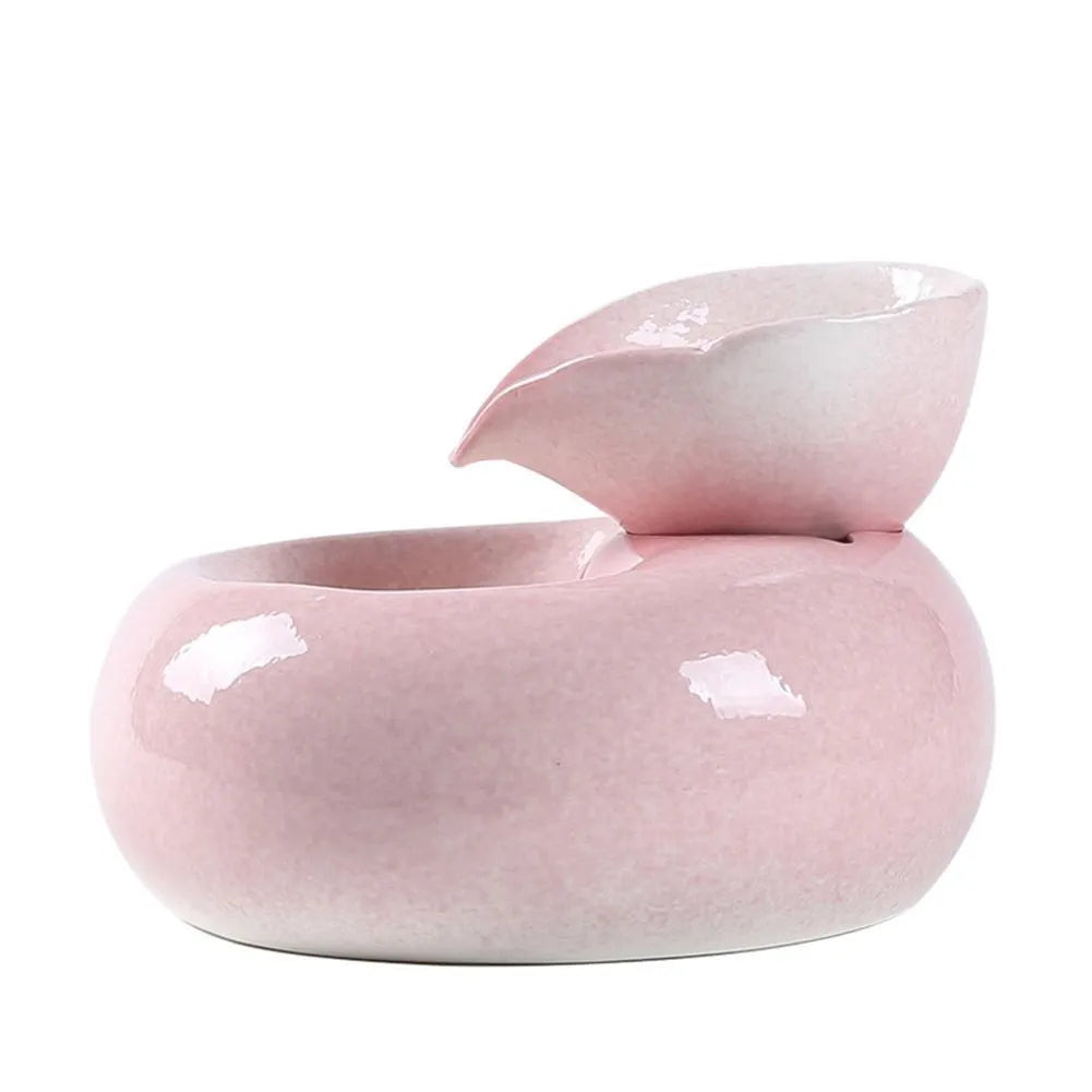 White porcelain leaf-shaped automatic cat water dispenser on floor